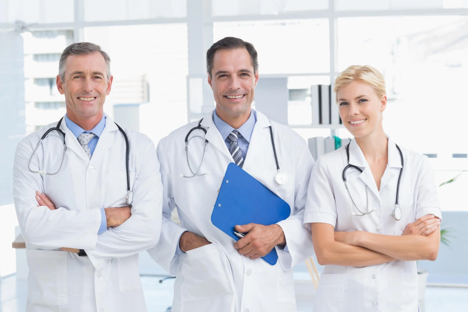 Team of cosmetic surgeons standing in medical clinic